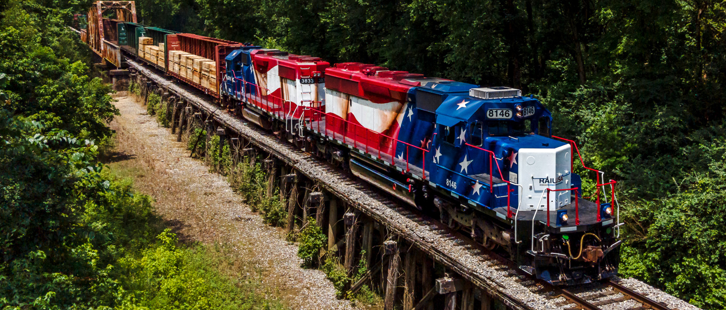 FG&A train on track over bridge